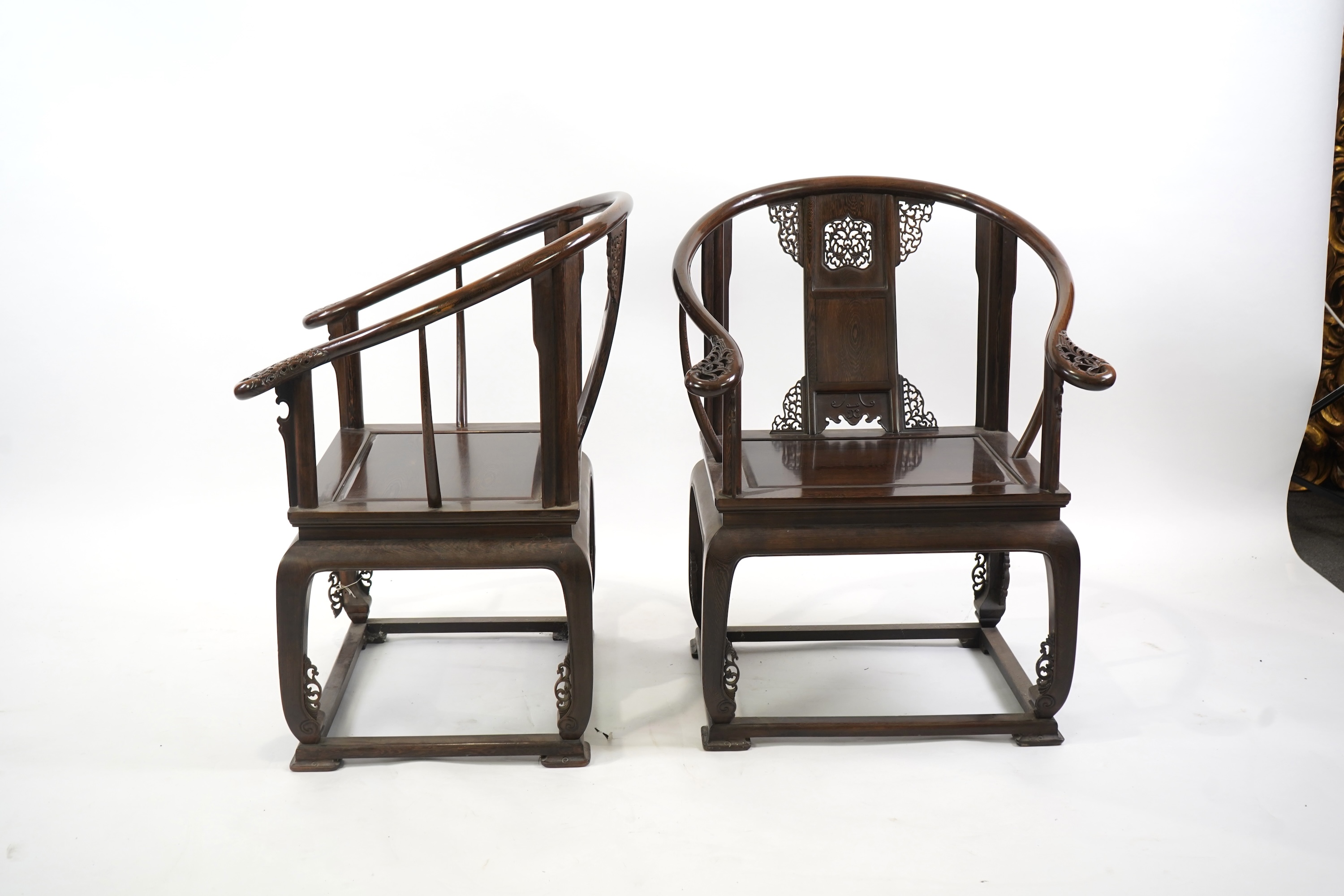 A pair of Chinese jichimu horseshoe shaped armchairs and a matching table, 19th/20th century